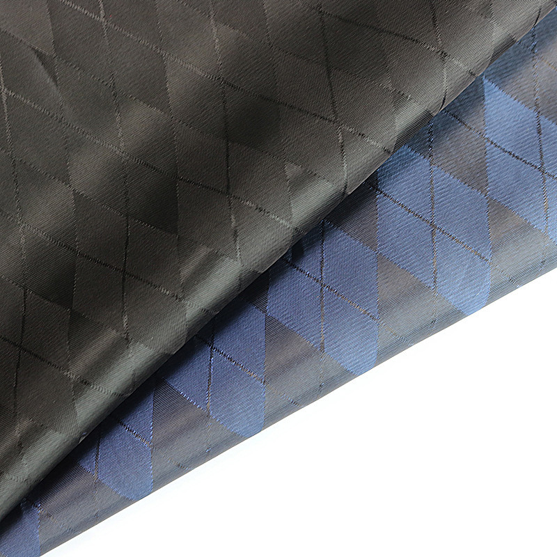 现货供应人丝涤粘里布料 涤纶人丝交织梭织里子布服装菱形格