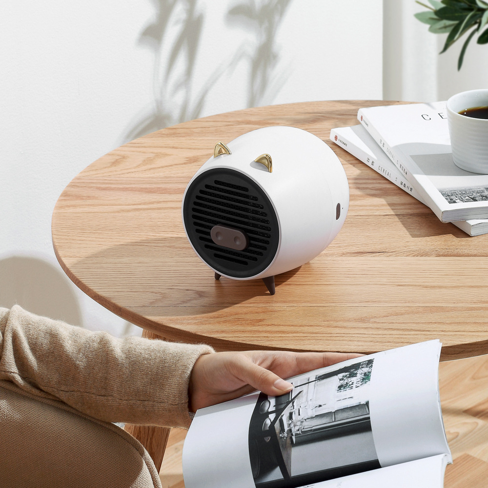 拾風(fēng)新款小豬暖風(fēng)機迷你辦公桌面便攜取暖器家用宿舍熱風(fēng)電暖器