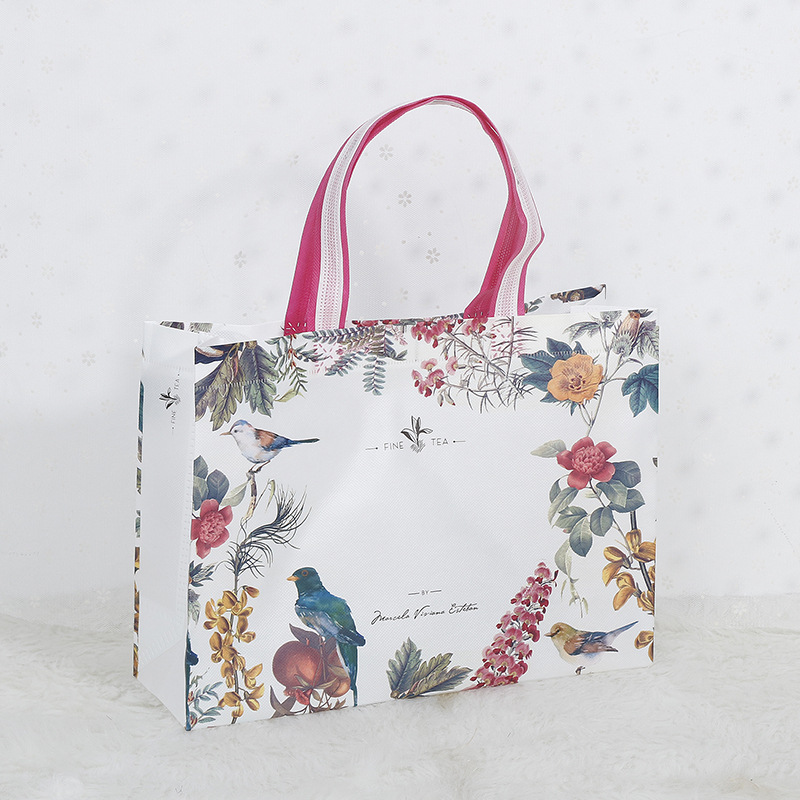 En stock bolsa de tienda de ropa logotipo personalizado bolsa de protección ambiental personalizada bolsa de embalaje de cuatro piezas bolso no tejido recubierto