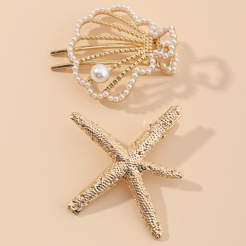 New Beach Hairpin Holiday Golden Starfish Pearl Hollow Small Shell Hairpin Side Clip Wholesale Nihaojewelry display picture 1