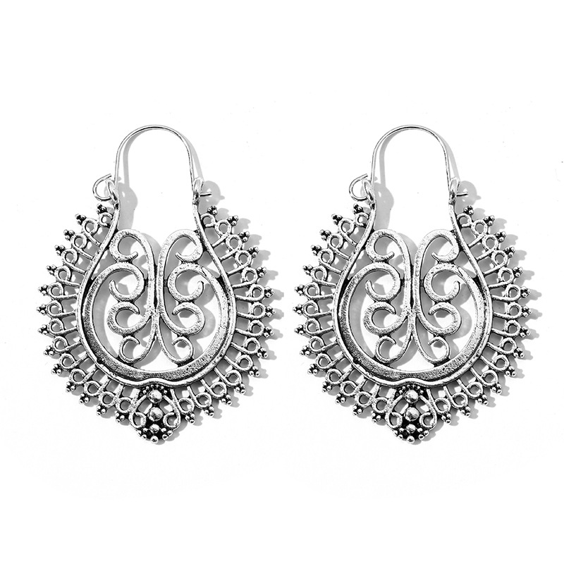 Retro Exaggerated Bohemian Metal Alloy Hollow Carved Round Earrings Wholesale Nihaojewelry display picture 1