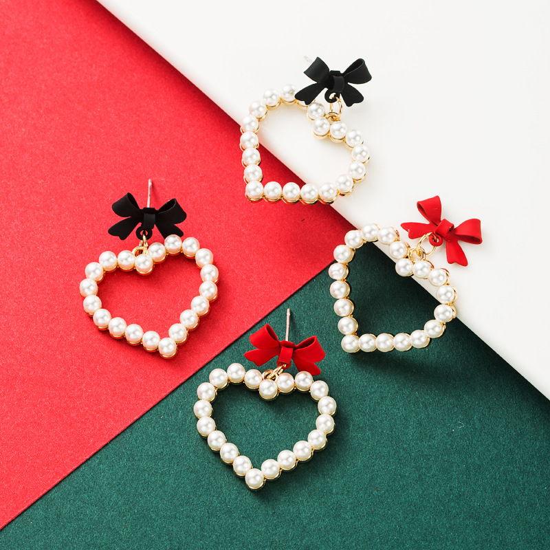 Alloy Spray Paint Bow Love Heart-shaped Imitation Pearl Earrings display picture 2