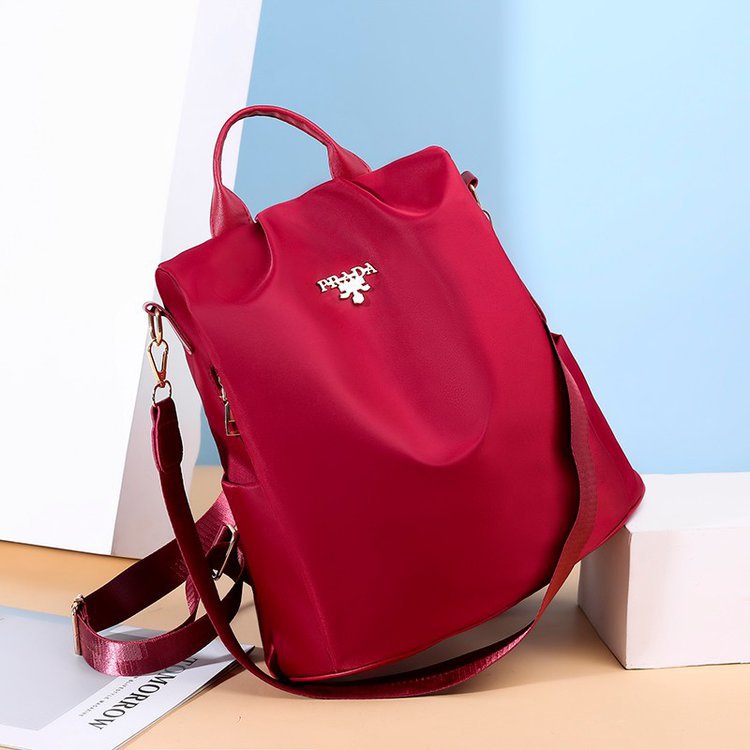 Nuevo estilo de campus de gran capacidad de nylon impermeable antirrobo viaje multifuncional estilo coreano mochila mujer color sólido todo a juego