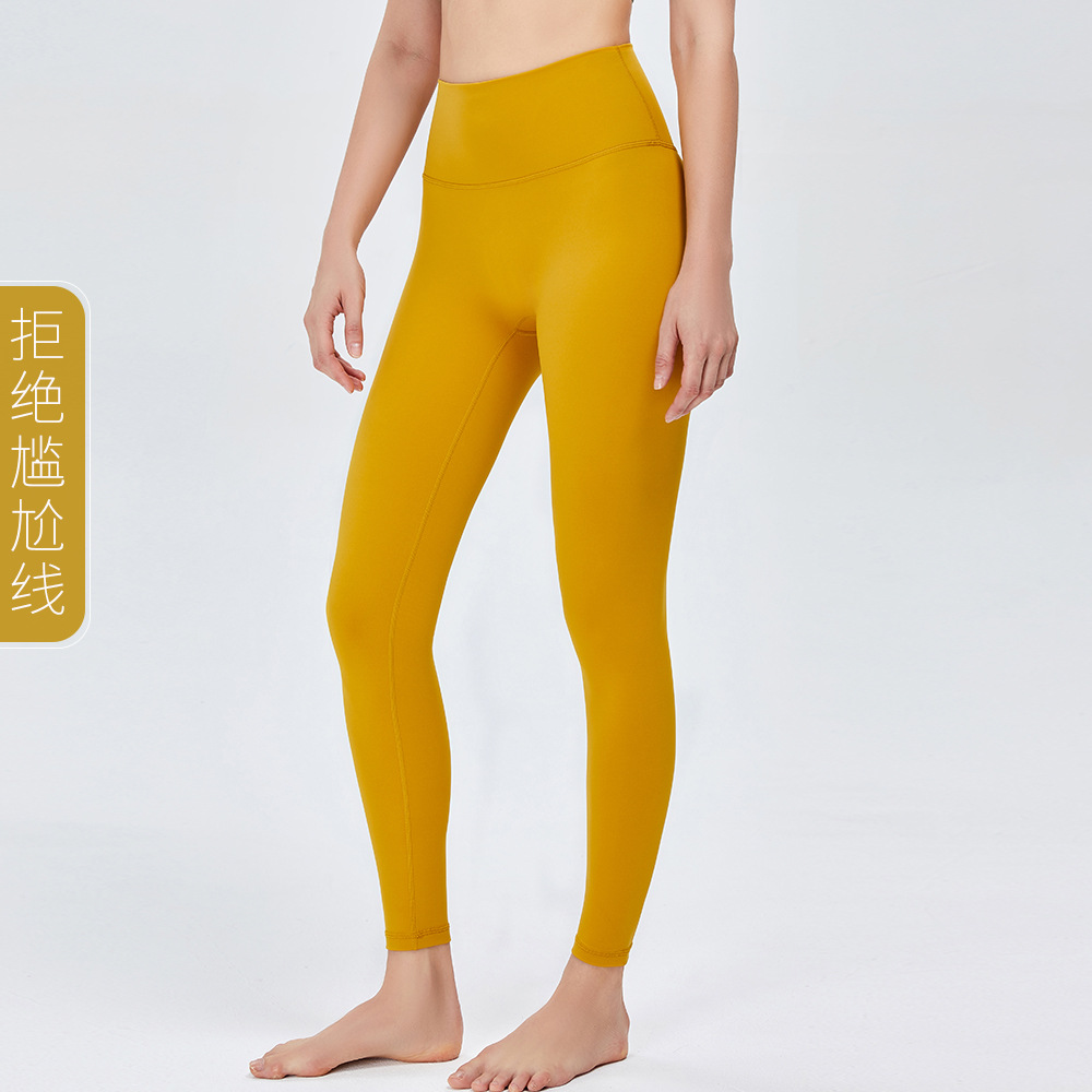 Nuevos pantalones de yoga de cintura alta desnuda europea y americana de las mujeres corriendo Pantalones deportivos sin vergüenza línea apretado cadera levantamiento fitness Pantalones