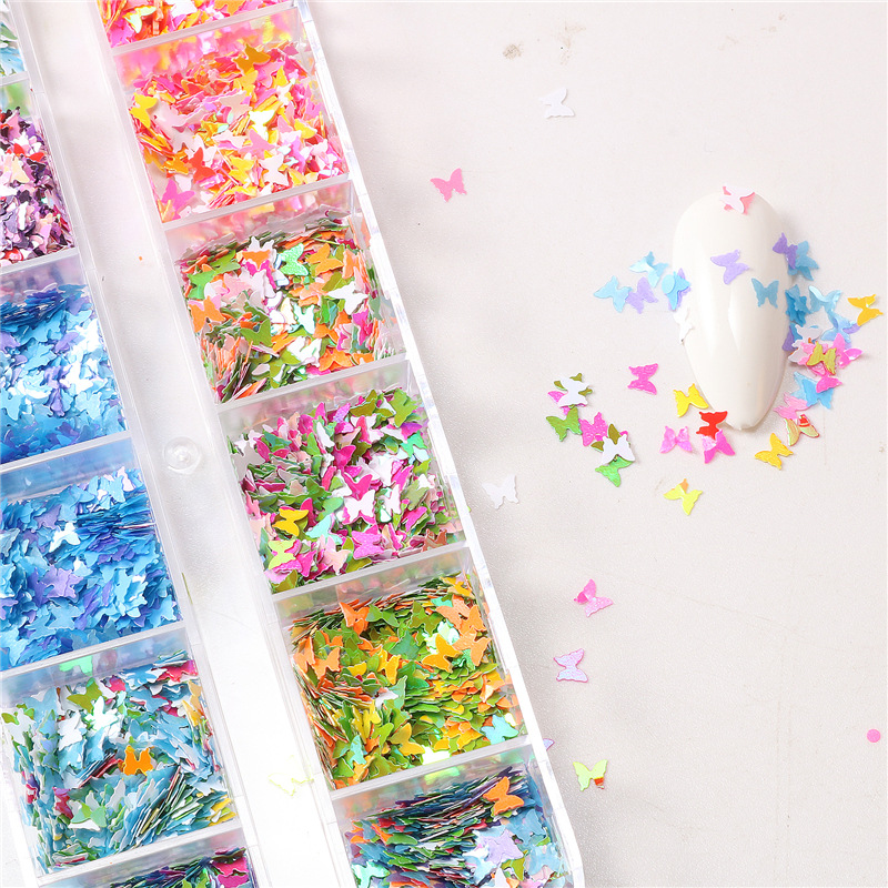 Amazon Venta caliente uñas mariposa lentejuelas 12 rejilla tira caja uñas lentejuelas mariposa color redondo uñas joyería