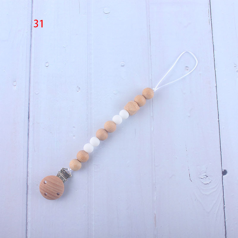 Nueva fábrica directa bebé Beech juguete mordedor bebé chupete de silicona pezón anti-gota cadena materna y infantil suministros