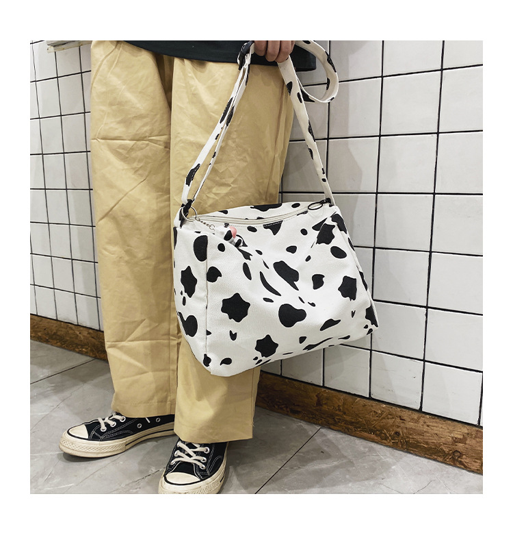 Korean New Simple Lazy Style Cute Cow Polka Dot Student Canvas Bag Class Bag Wild Messenger Bag Wholesale display picture 38