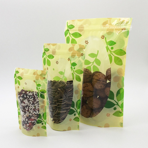 Factory direct sales green leaf three-color flower self-sealing self-standing bag flower tea sealing bag dried fruit and grain food packaging bag