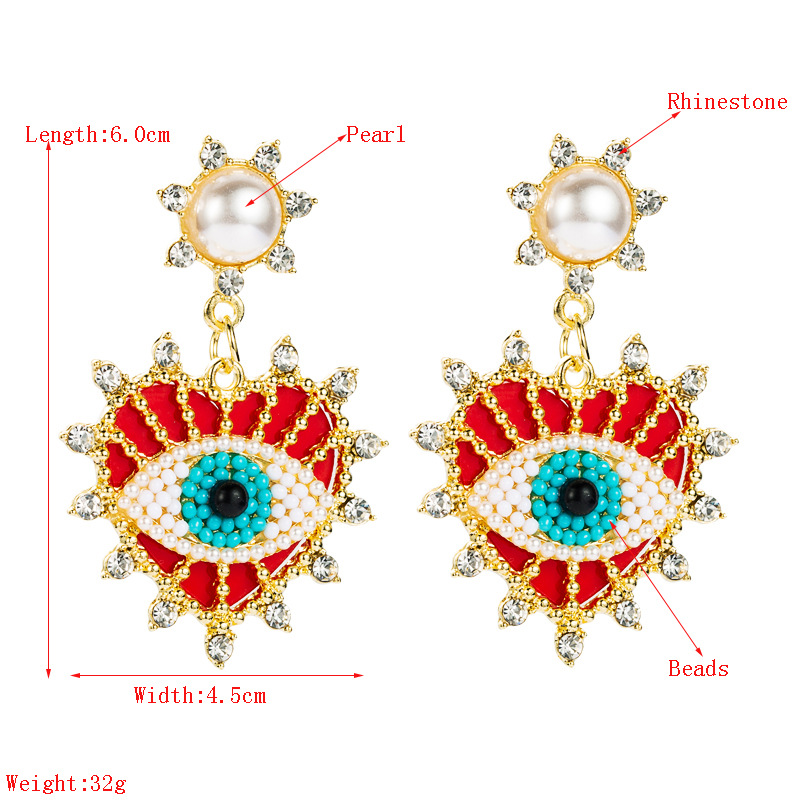 Exquisite Devil's Eyes Diamond-studded Pearl Heart-shaped Earrings display picture 1