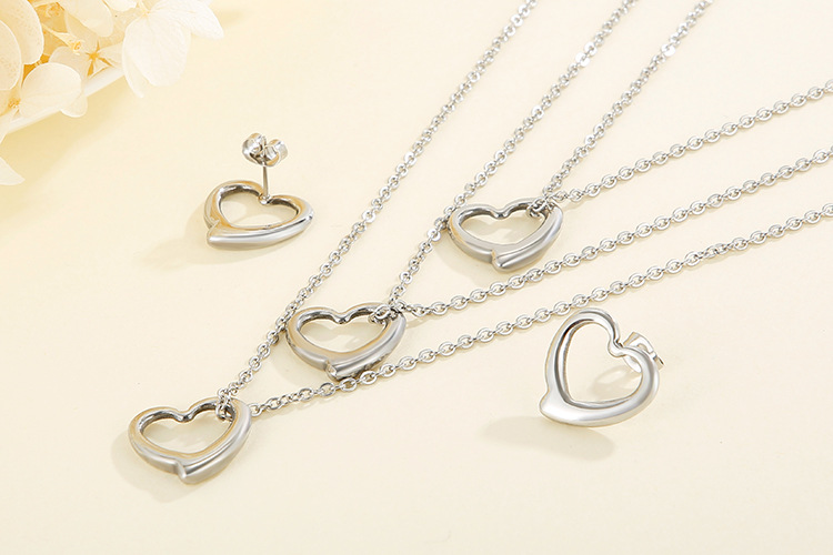 hollow heart-shaped three-layer necklace clavicle chain earrings set titanium steel set