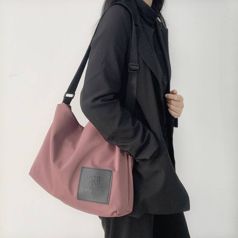 Bolsa de mensajero de estilo japonés simple todo fósforo bolsa de lona de nylon impermeable estilo de Hong Kong hombro de gran capacidad de moda para hombres y mujeres estudiantes