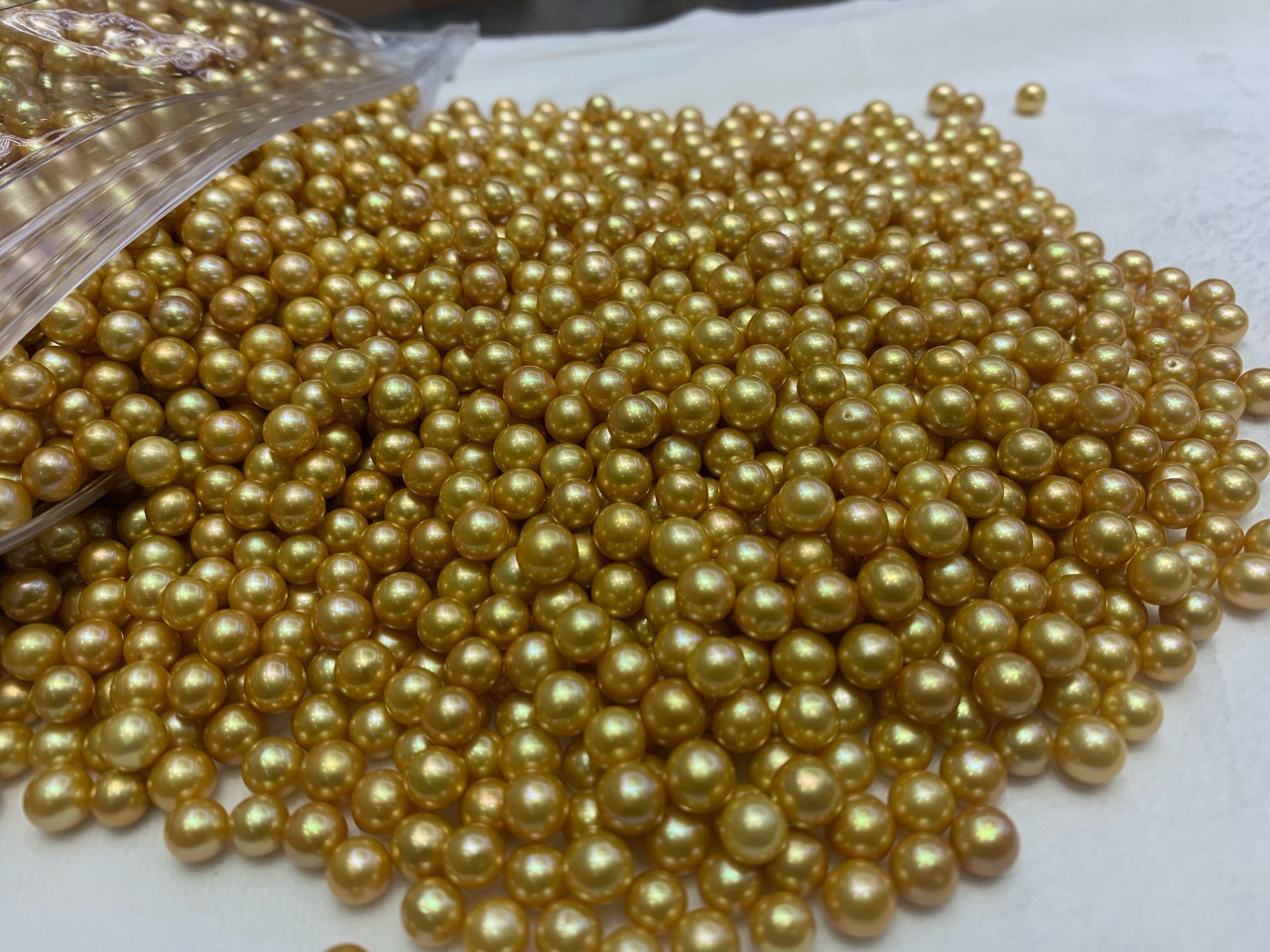 有核淡水优化金珠6-7mm统货批发圆近圆媲美南洋金珠微瑕孔后无瑕