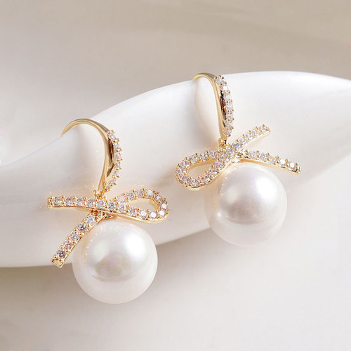 Korean new ear hook short symmetrical bow pearl earrings personality simple temperament small internet celebrity earrings for women