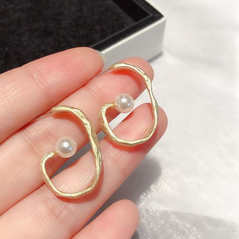 Asymmetrical matte golden earrings handmade pearl