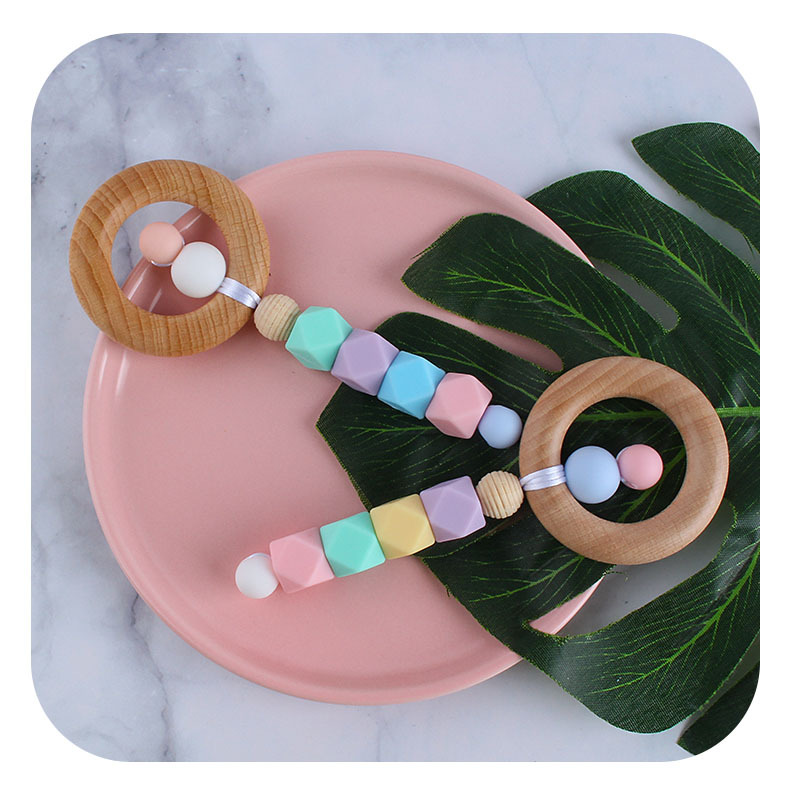 Nueva historieta DIY haya anillo mano palo juguete mordedor bebé cuentas de silicona dientes molienda palo Amazon nuevo