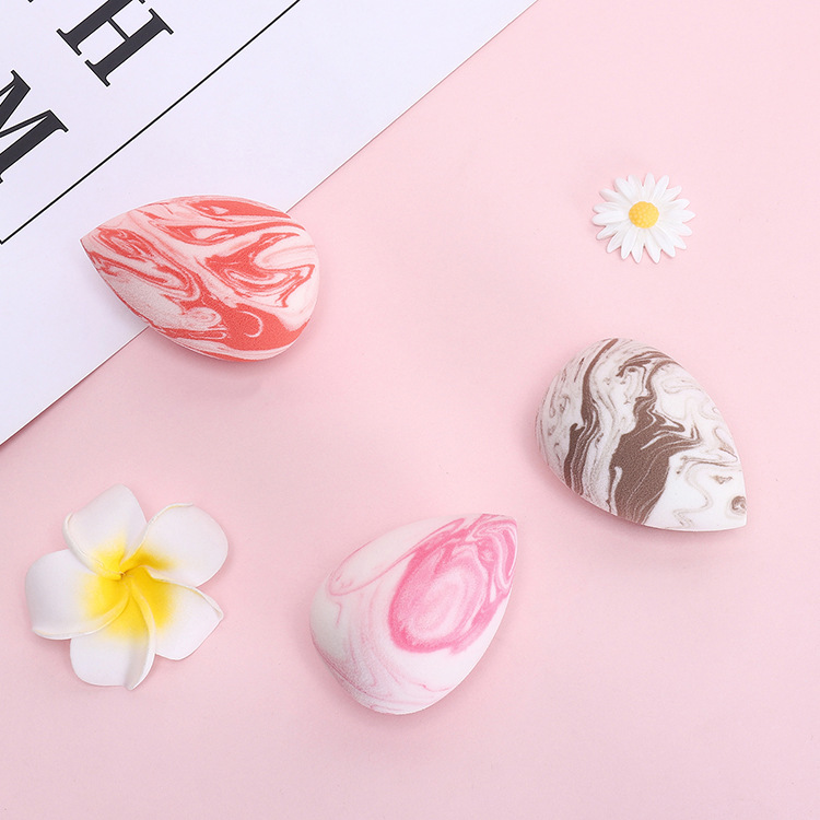 Huevo de belleza de dos colores húmedo y seco de doble uso maquillaje gota de agua soplo de polvo hidrófilo sin látex esponja remojo agua se convierte en huevo de maquillaje más grande