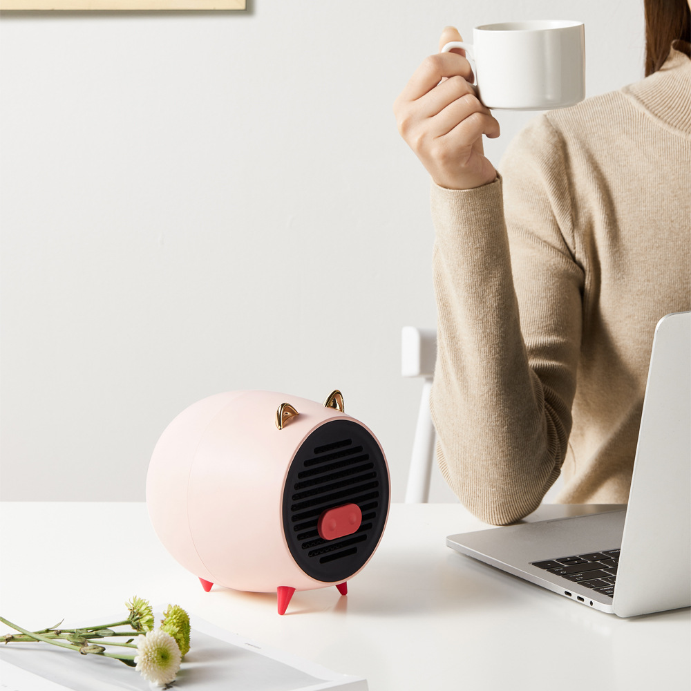 拾風(fēng)新款小豬暖風(fēng)機迷你辦公桌面便攜取暖器家用宿舍熱風(fēng)電暖器