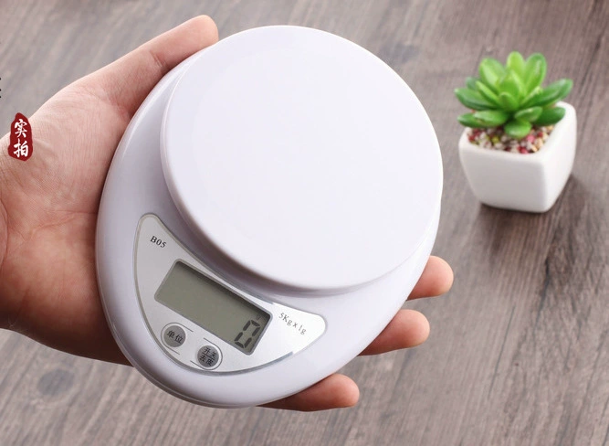 Small handheld electronic scales, handmade soap, candle, electronic lipstick