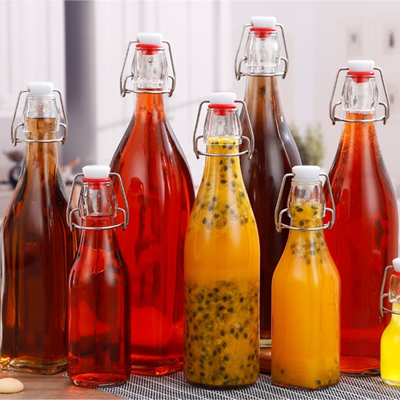 厂家批发卡扣玻璃瓶500ml透明饮料瓶圆形乐扣果酒瓶果汁饮料瓶