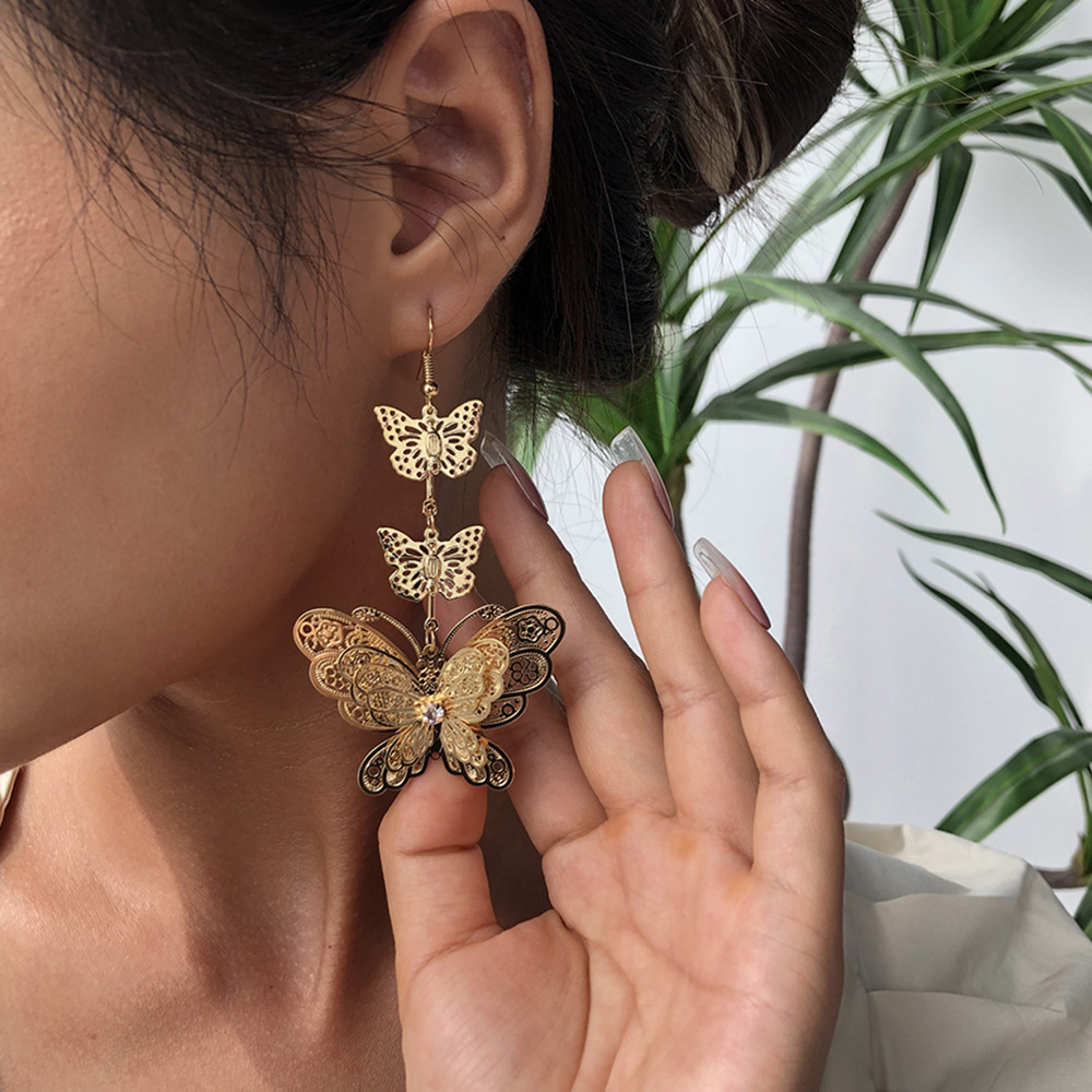 E8440 Europe and America Trend personality Earrings have more cash than can be accounted for butterfly Exaggeration three layers butterfly electroplate Earrings Selling Earrings