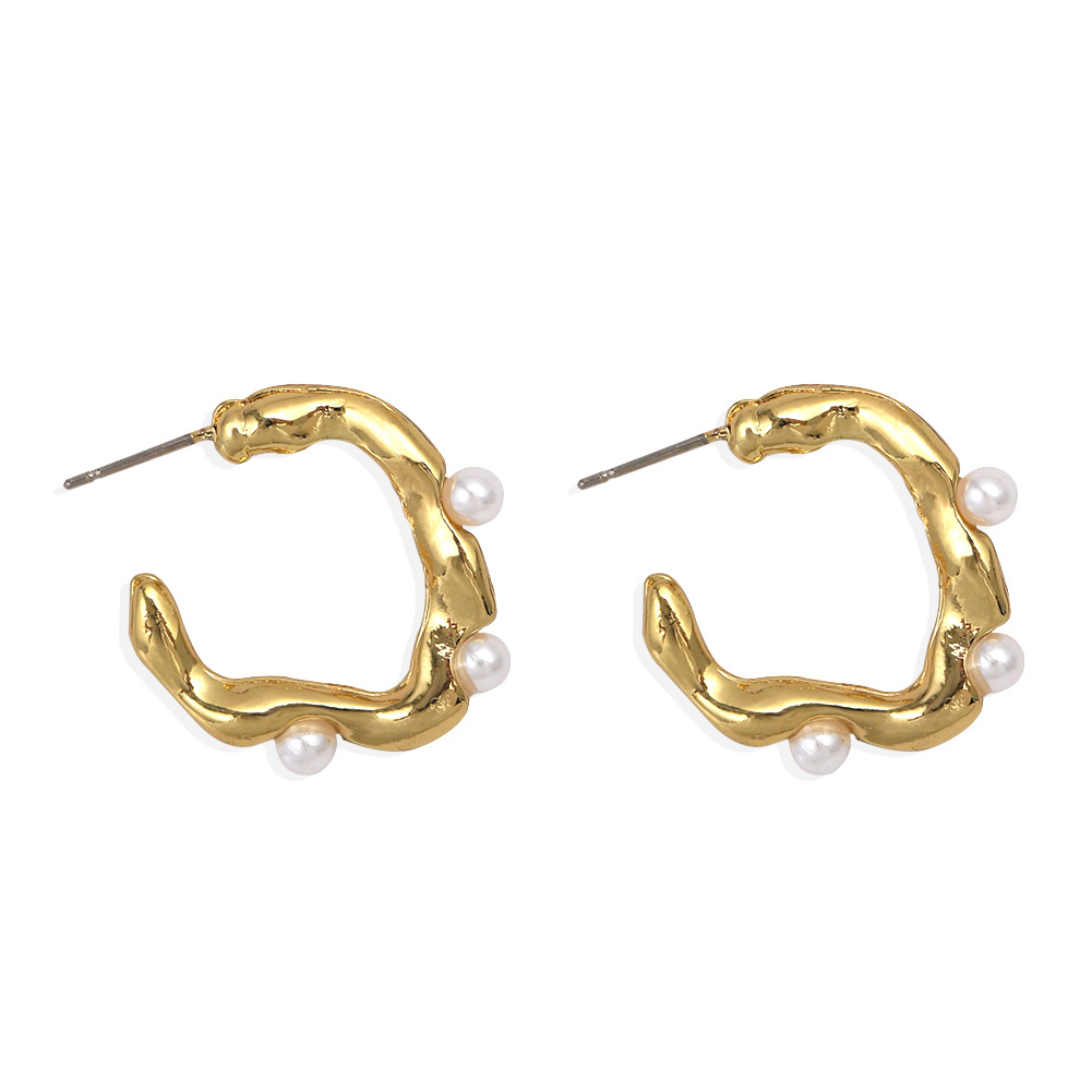 Pure White Pearl Inlaid Wavy Round Hollow Creative Fashion Earrings Wholesale display picture 9