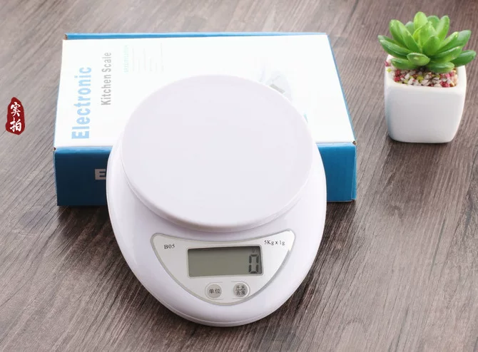 Small handheld electronic scales, handmade soap, candle, electronic lipstick