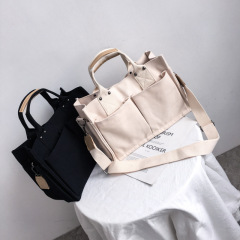 帆布包韓國簡約時尚多口袋手提包新款單肩托特包大容量斜挎女包