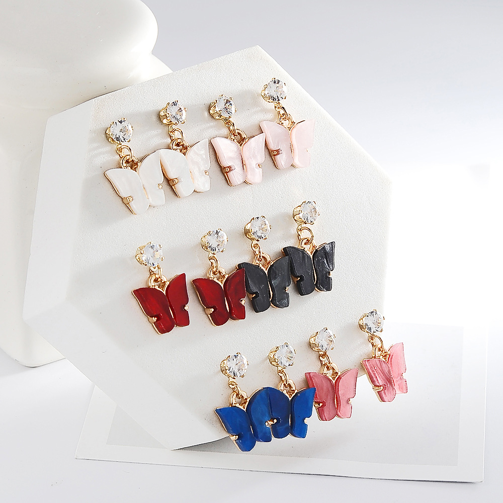 Style Coréen Vente Chaude Couleur Douce Zircon Acrylique Boucles D'oreilles Papillon Boucles D'oreilles Simples En Gros Nihaojewelry display picture 4