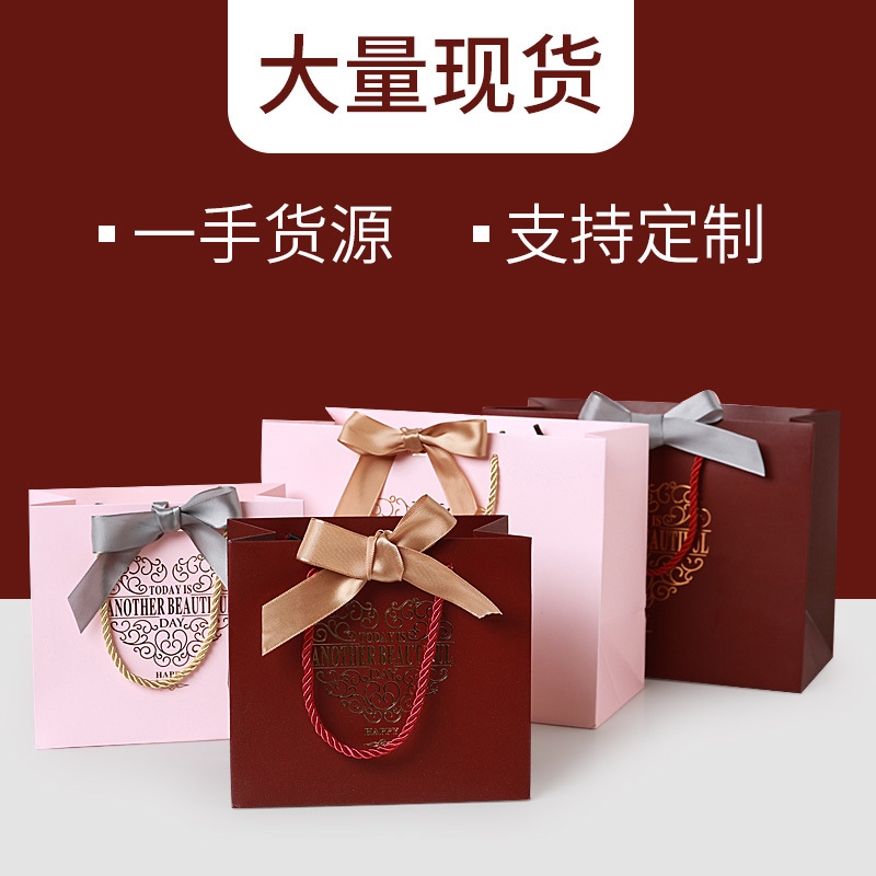 广成包装情人节包装袋纸蝴蝶结婚庆礼品袋化妆品手提袋纸袋定制