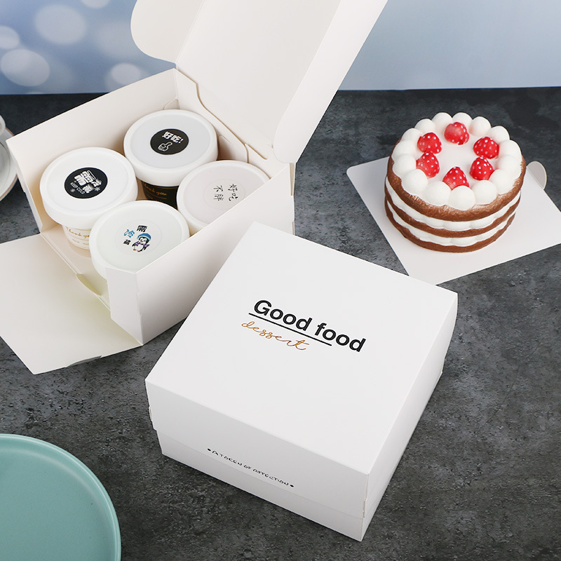 Tarjeta blanca dorado postre francés merienda caja helado taza caja de embalaje punto occidental corte pastel de queso para hornear