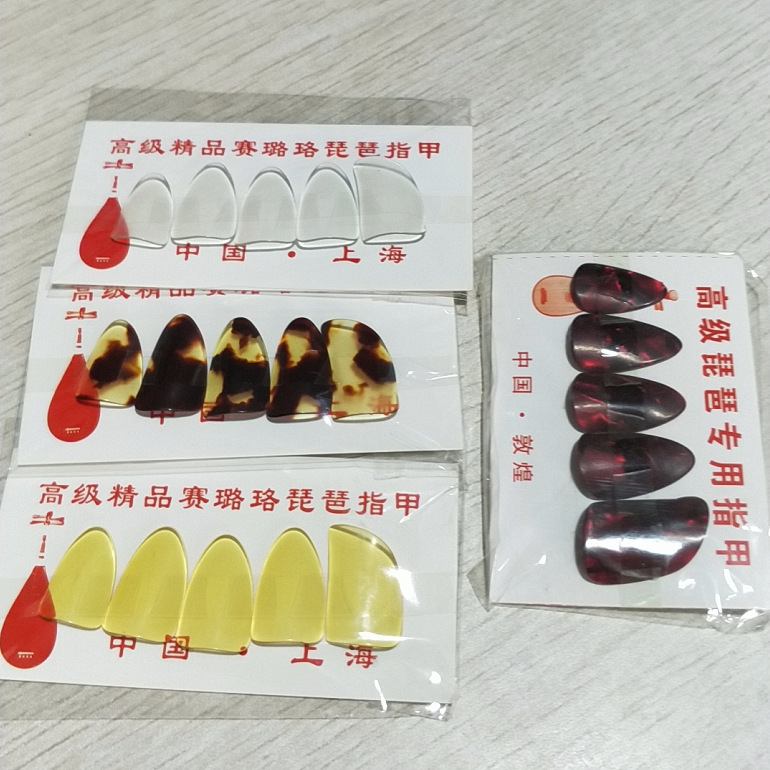 Factory wholesale adult children pipa nails celluloid material nails large, medium and small optional