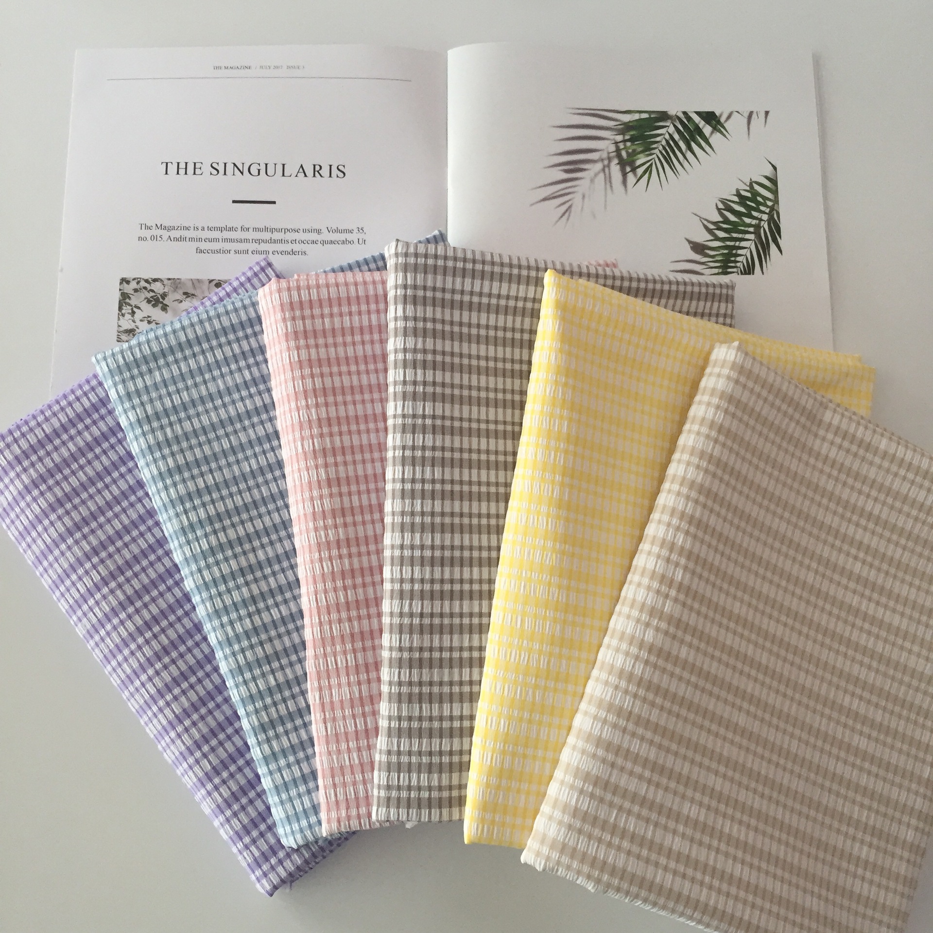 现货供应全涤弹力泡泡布厂家批发春夏休闲女装童装面料水洗皱布料