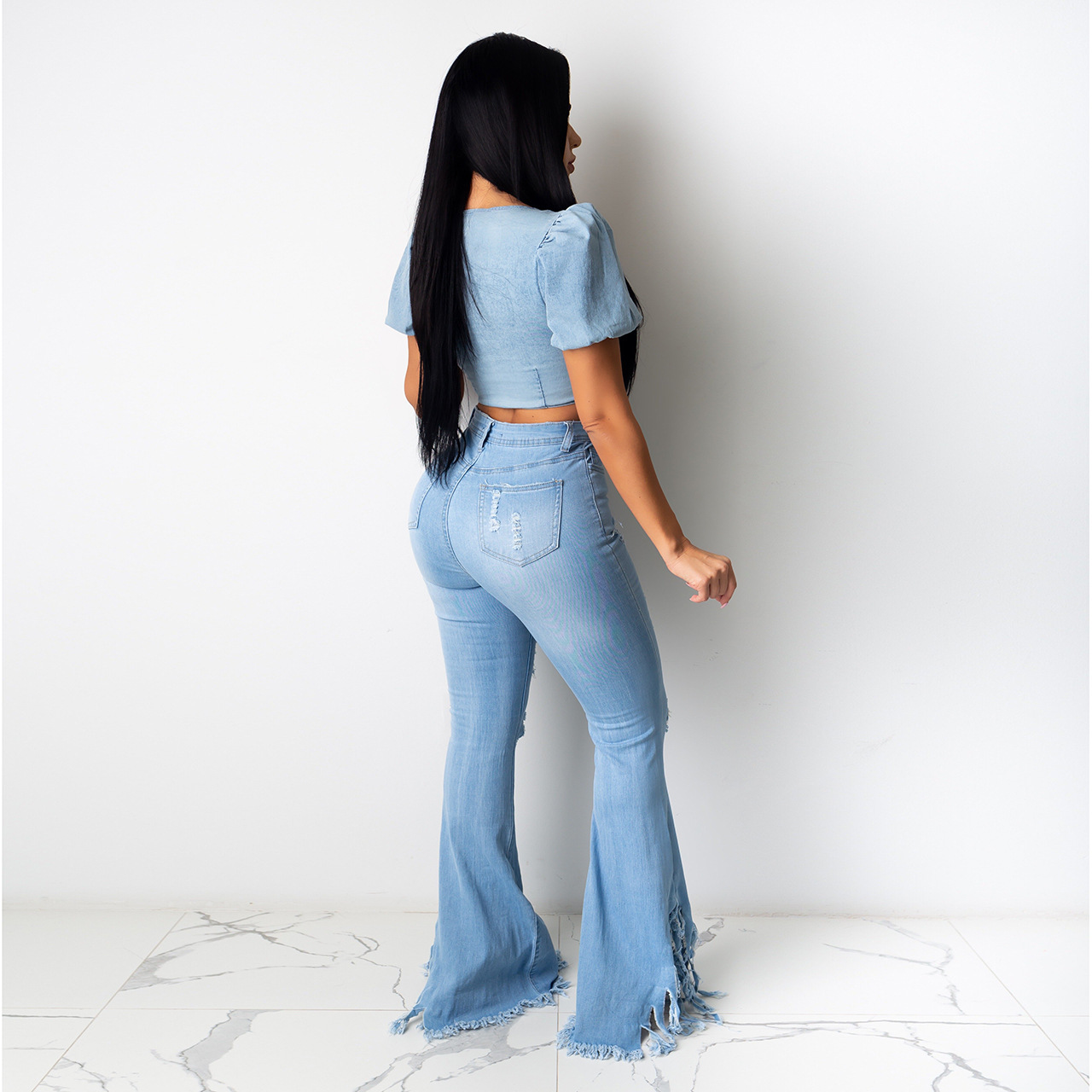Dames high waist jeans met split en franjes in flare model_voghion.com