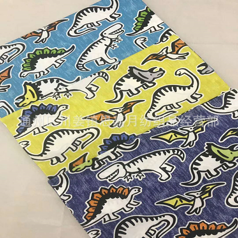 厂家促销全棉斜纹印花纯棉卡通布料床品面料罩衣宝宝布料恐龙翼龙