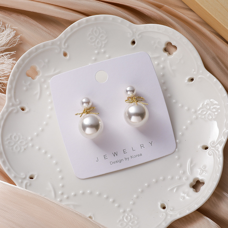 Korean  Simple  Pearl Bow Earrings display picture 2