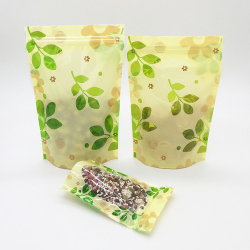 Factory direct sales green leaf three-color flower self-sealing self-standing bag flower tea sealing bag dried fruit and grain food packaging bag