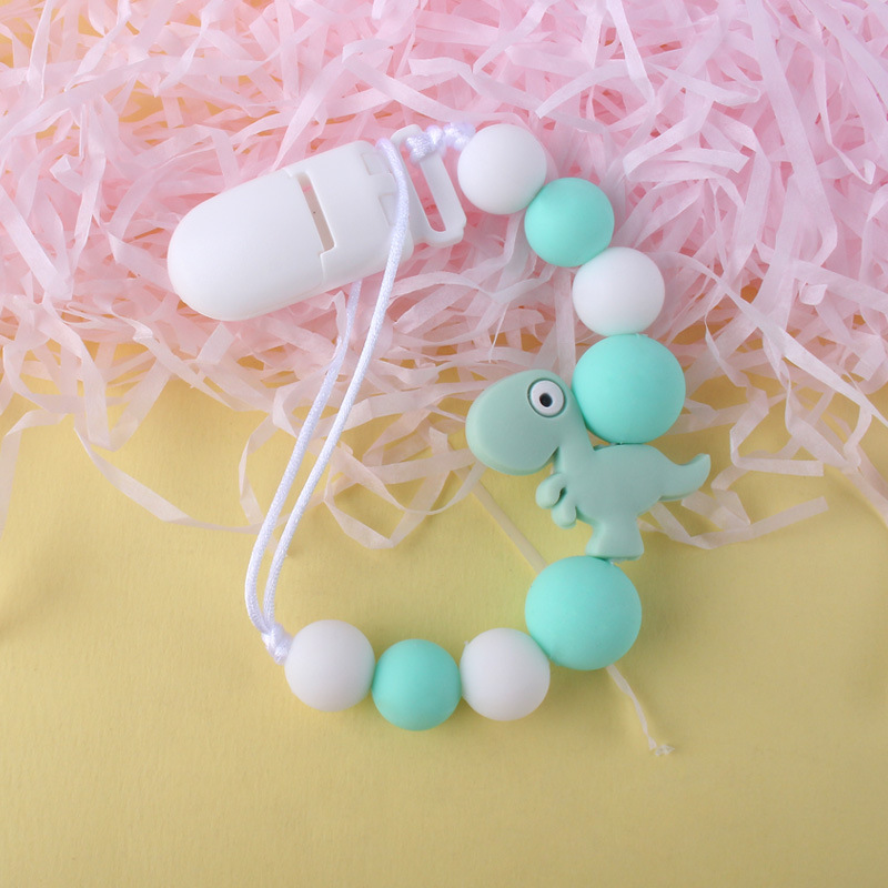 Pequeño dinosaurio bebé silicona pezón clip Cadena de dientes de bebé Cadena de molienda cadena anti-gota calmante teether pezón