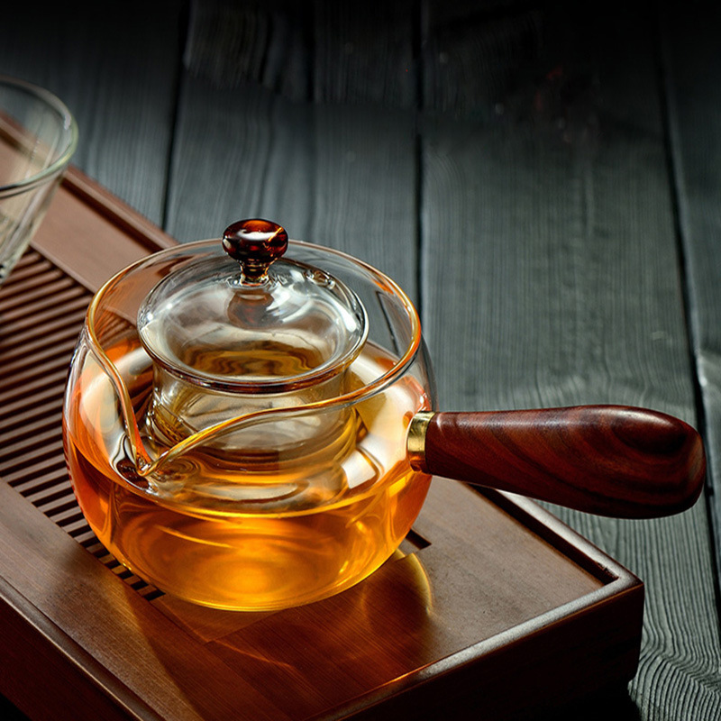 Fabricante de vidrio de borosilicato tetera pequeña verde naranja tetera eléctrica estufa de cerámica calefacción Kung Fu juego de té mango lateral tetera