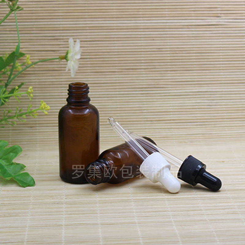 Brown botella de aceite esencial perfume gotero botella de prensa cosmético de vidrio sub-embalaje marrón mezcla botella vacía cabeza de goma de grano fino negro