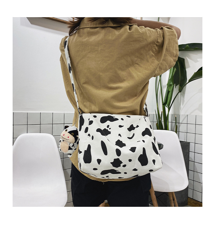 Korean New Simple Lazy Style Cute Cow Polka Dot Student Canvas Bag Class Bag Wild Messenger Bag Wholesale display picture 30