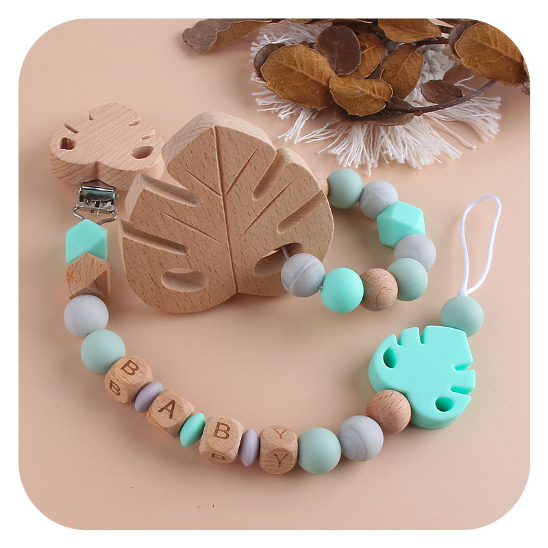 Nombre del bebé personalizable Cadena de chupete de hoja de silicona Bebé suministros de haya hoja chupete clip juguete mordedor