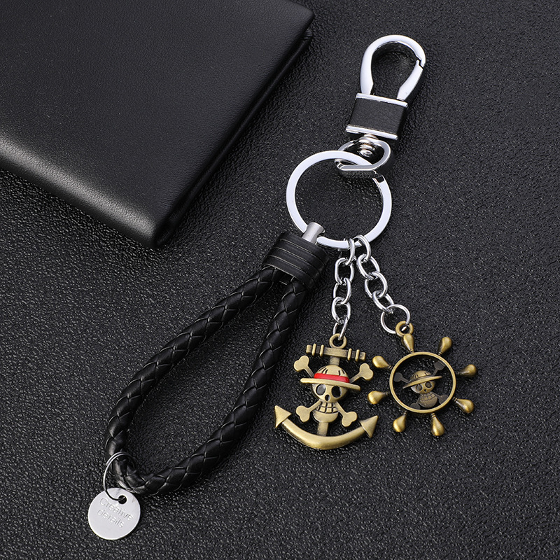 Wholesale Creative One Piece Straw Hat Metal Keychain Road Flying Man Straw Hat Skull Keychain Animation Peripheral Gift