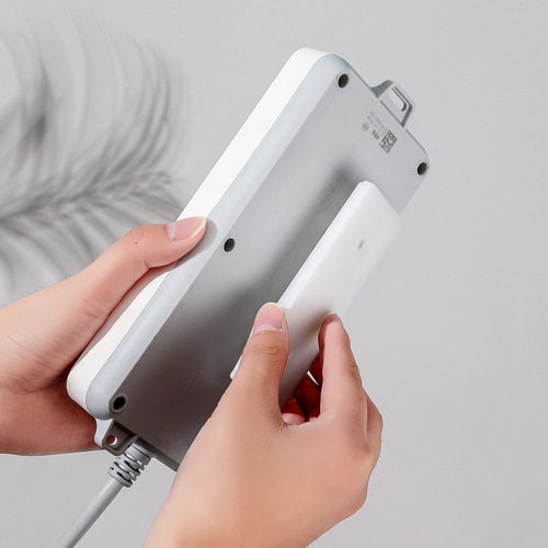 Creative power strip holder Home wall punch-free power strip strong traceless adhesive wall-mounted