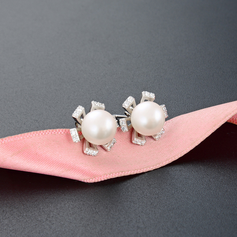 S925 pendientes de perlas de plata esterlina temperamento de moda de las mujeres 2023 nuevo diseño de nicho pendientes de flores pendientes