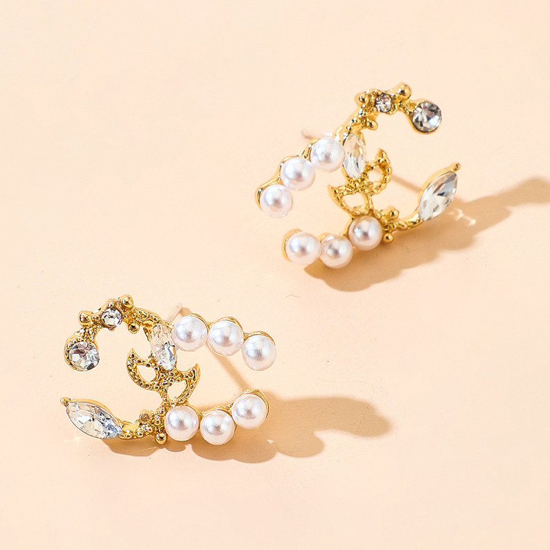 Korean Style Asymmetry Stars Elk Bow Pearl Earrings Simple Spread Wholesale Nihaojewelry display picture 10