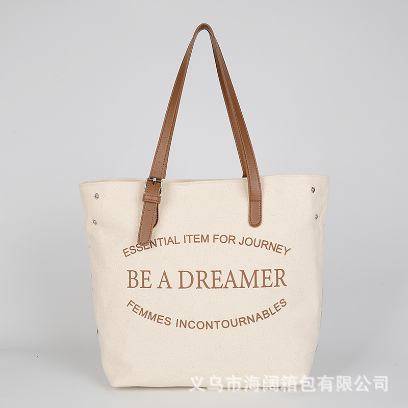 日韩新款大容量手提帆布包韩版时尚百搭竖款印花通勤包女士托特包