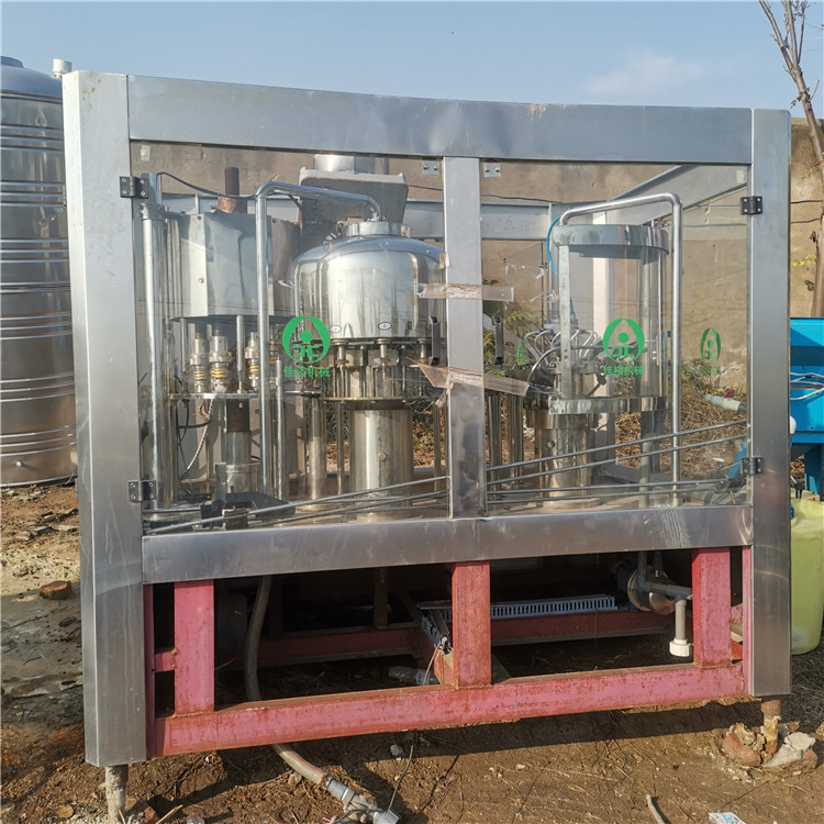 销售二手饮料灌装机设备 三合一矿泉水灌装机 24头液体灌装机价格