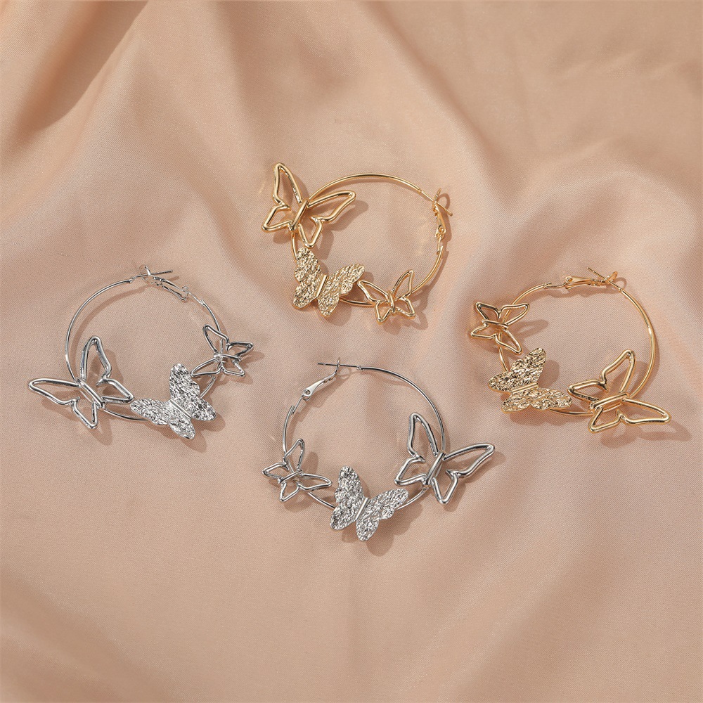 Nouvelle Personnalité Simple Exagérée Boucles D&#39;oreilles Trois Papillons Creux En Gros display picture 5