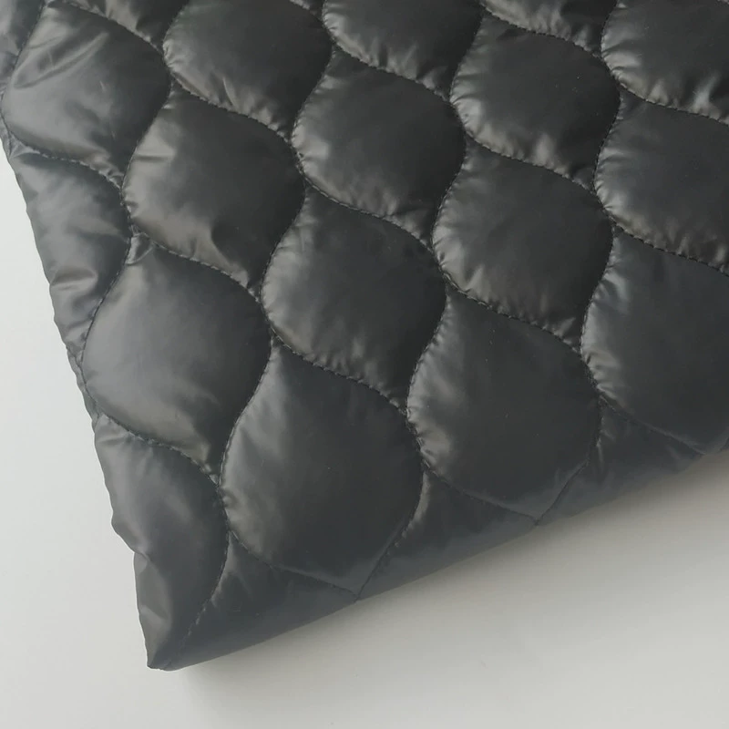 Polyester taffeta embroidered fabric 50D high-density film calendered quilted 140g spray-coated cotton composite quilted warm down