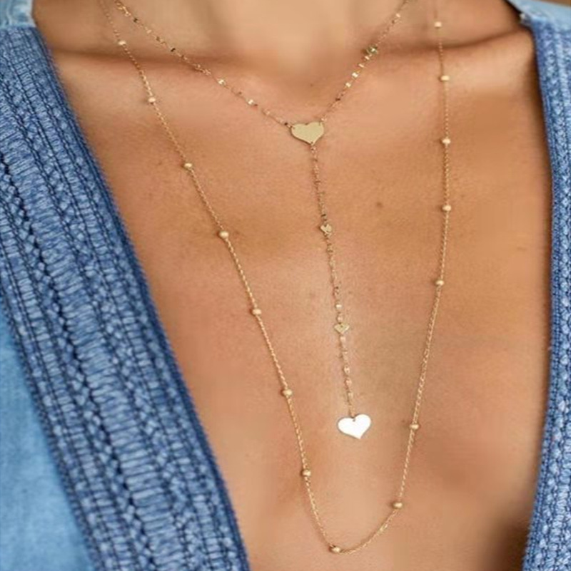 Nouvelle Alliage De Mode Créative Multicouche Perle Ronde Amour Gland Collier En Forme De Coeur Chaîne De Chandail En Gros Nihaojewelry display picture 2